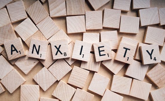 Scrabble tiles that spell out Anxiety